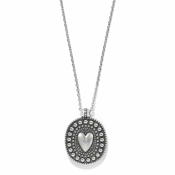 Brighton pendant necklace with silver-plated beaded oval, raised heart, and crystal accent on a white background