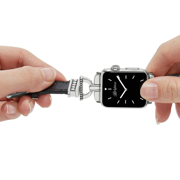 Model attaching a Brighton black leather watch band with silver-plated beaded accents to a square smartwatch