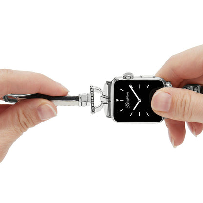 Close-up of Brighton smartwatch band with silver-plated crystal-accented hardware and black leather strap being attached