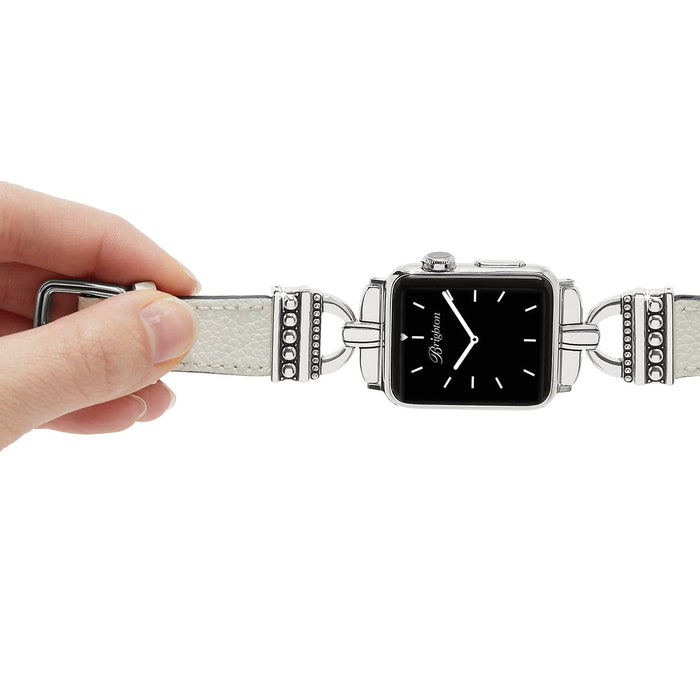 Model adjusting a Brighton watch band with white leather strap and silver-plated beaded accents framing the watch face