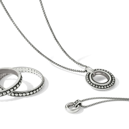 Brighton silver-plated pendant necklace styled with a beaded ring bracelet on a white background