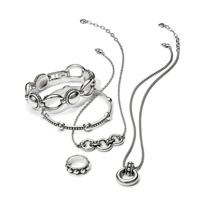 Brighton silver-plated jewelry set styled with bracelets, a ring, and necklaces featuring beaded and oval link details