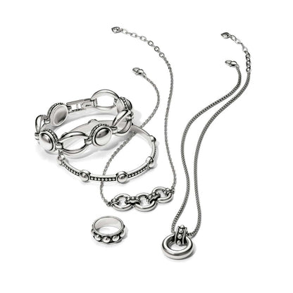 Brighton silver-plated jewelry set styled with bracelets, a ring, and necklaces featuring beaded and oval link details