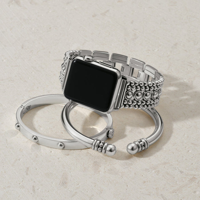 Brighton smartwatch band with silver-plated beaded links, styled with two coordinating cuff bracelets on a neutral background