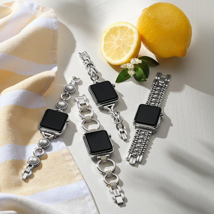 Brighton silver-plated watch bands styled with lemons and a striped towel on a white background
