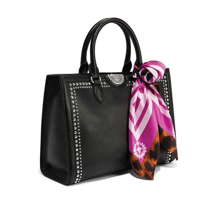Brighton black leather handbag with silver-tone studded trim and pink leopard print scarf accent on a white background