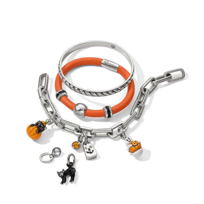 Brighton bracelets styled with silver-plated Halloween charms including pumpkins, black cat, and crystal accents on white background