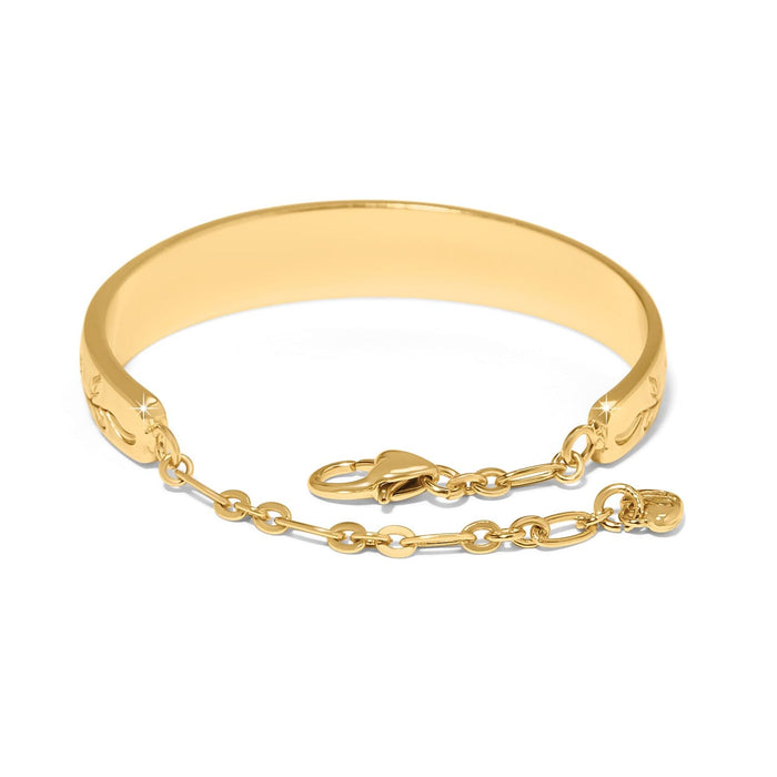Brighton bangle bracelet with gold-plated finish, etched detailing, chain extender, and lobster clasp on a white background