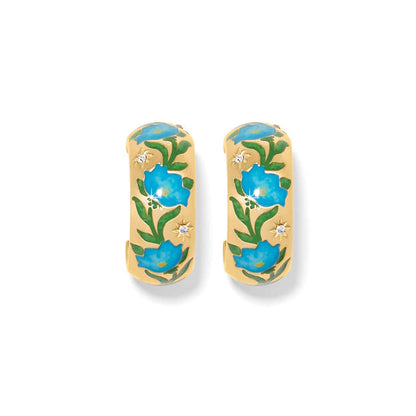 Brighton hoop earrings with gold-plated finish, blue enamel floral design, green leaves, and crystal accents on a white background
