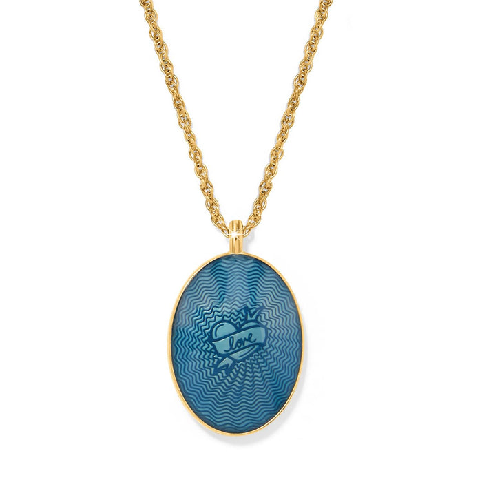 Brighton pendant necklace with gold-plated chain and blue oval enamel pendant featuring love heart motif on a white background