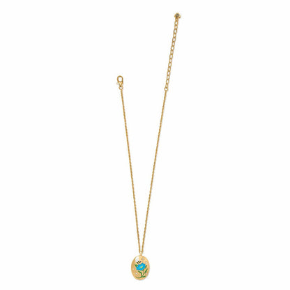 Brighton pendant necklace with gold-plated oval pendant featuring enamel blue flower, bee, and crystal accents on a white background