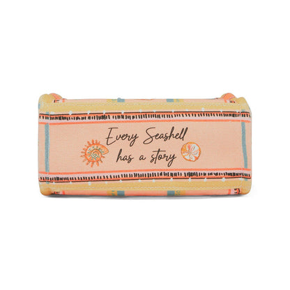 Brighton handbag shown from the bottom with peach striped print and "Every Seashell has a story" text on a white background