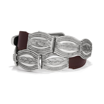 Brighton brown leather belt with ornate silver-tone braided rope buckle plates and beaded edging on a white background