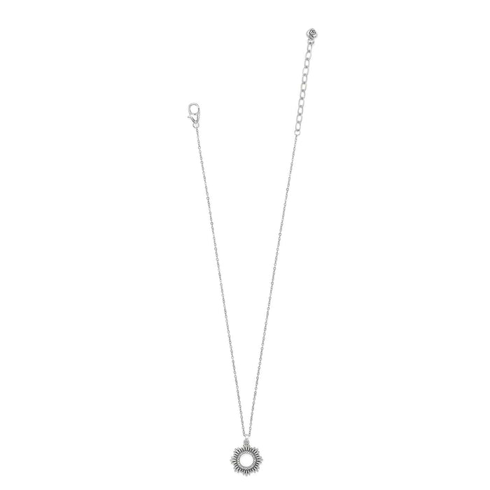Brighton pendant necklace with silver-tone sunburst circle pendant, crystal accents, and lobster clasp on a white background
