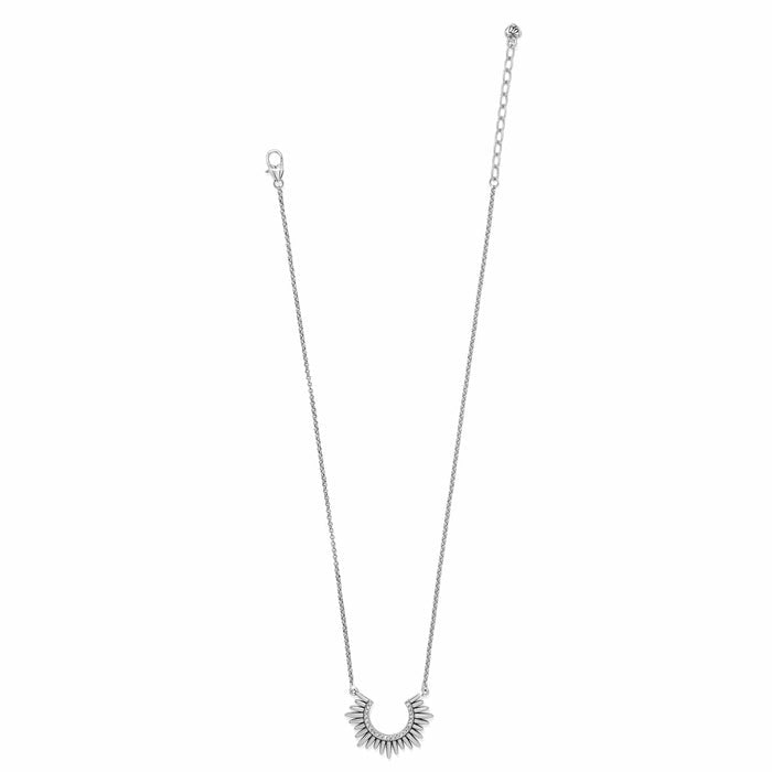 Brighton necklace with silver-tone sunburst pendant featuring crystal accents and lobster clasp chain on a white background