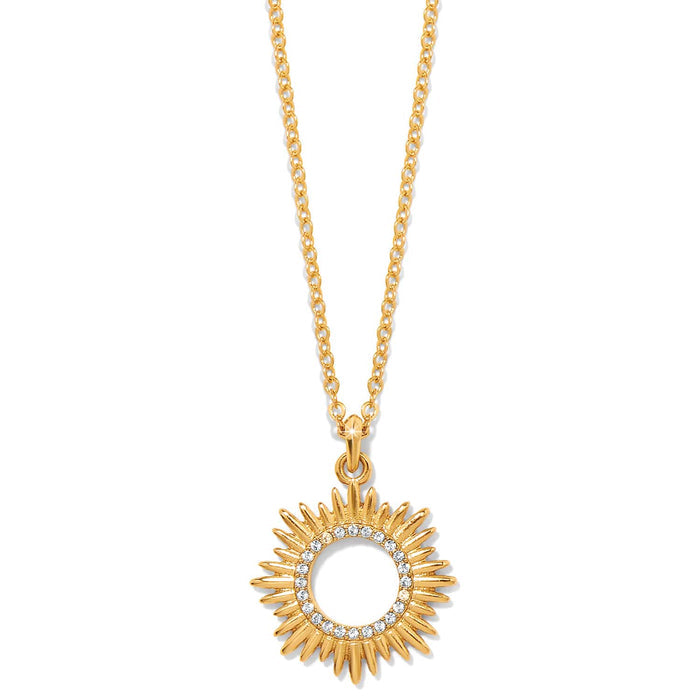 Brighton pendant necklace with gold-plated sunburst design and crystal-lined inner circle on a white background