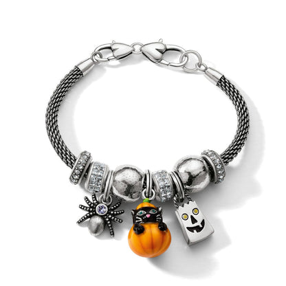 Brighton silver-plated charm bracelet with Halloween pumpkin, black cat, spider, ghost charms and crystal beads on white background