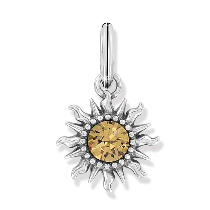 Brighton sun charm with silver-plated flame rays and golden crystal center surrounded by beaded detail on a white background