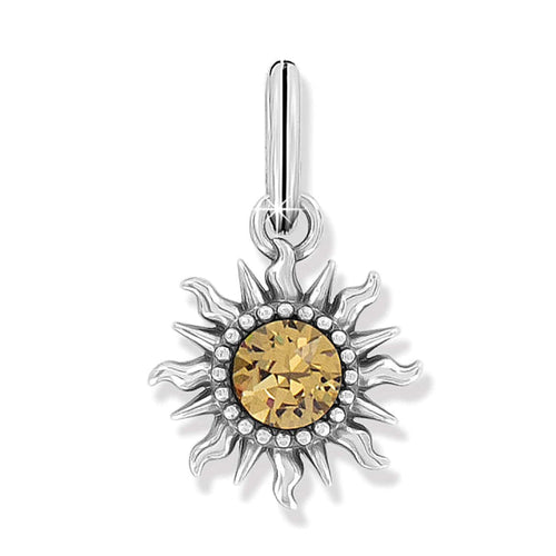 Brighton sun charm with silver-plated flame rays and golden crystal center surrounded by beaded detail on a white background