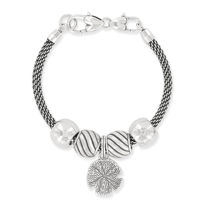 Brighton charm bracelet with silver-plated beads, crystal accents, and sand dollar charm on a white background