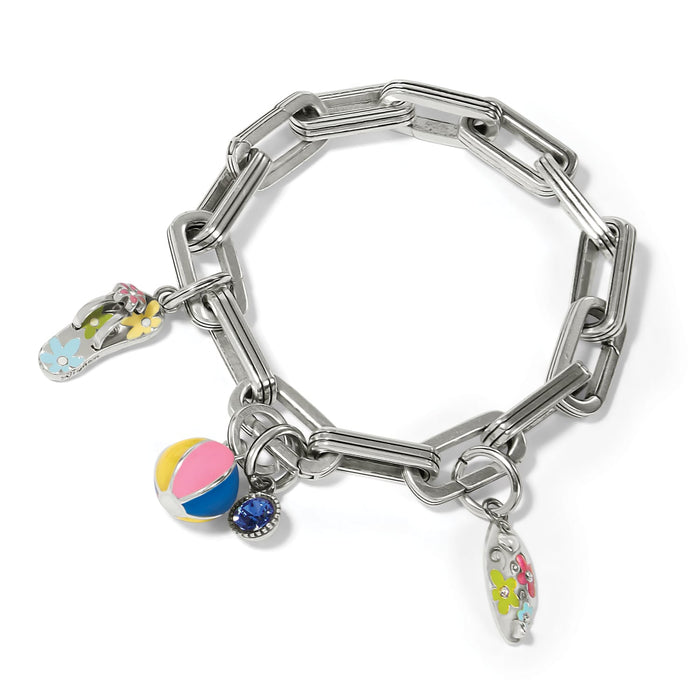 Brighton charm bracelet with silver-tone link chain, enamel flip-flop, beach ball, and surfboard charms on a white background