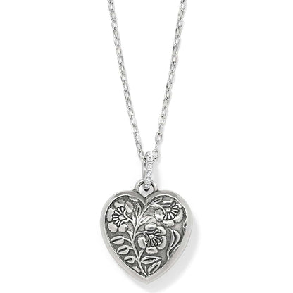 Brighton heart pendant necklace with silver-plated floral relief design and crystal-accented bail on a white background