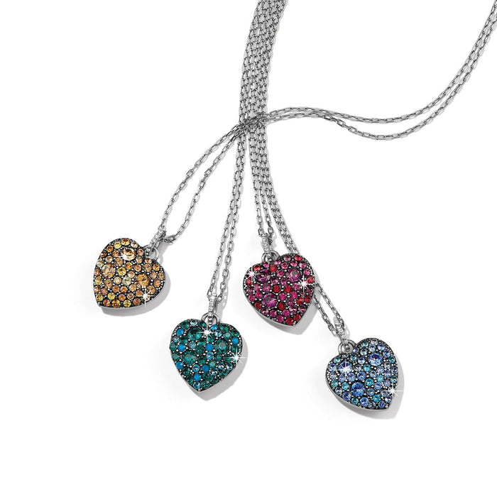 Brighton heart pendant necklaces with amber, teal, pink, and blue crystals on silver-plated chains on a white background
