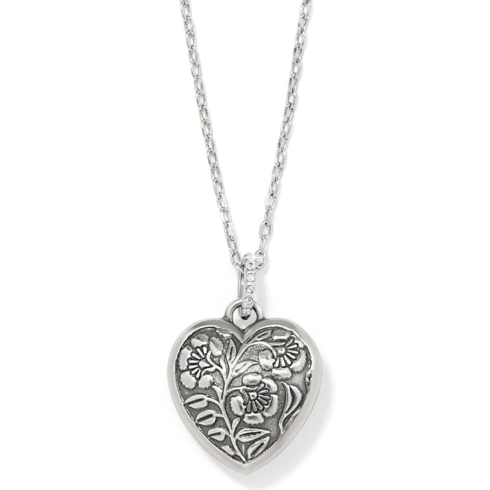 Brighton heart pendant necklace with silver-plated floral relief design and crystal-accented bail on a white background