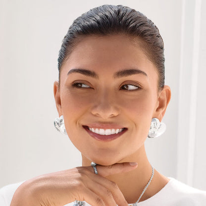 Model wearing Brighton silver-plated hammered floral earrings paired with a coordinating silver-plated chain necklace