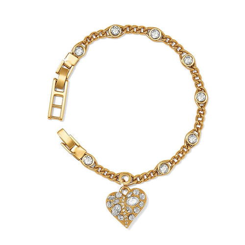 Brighton gold-plated chain bracelet with crystal stations and dangling crystal heart charm on a white background
