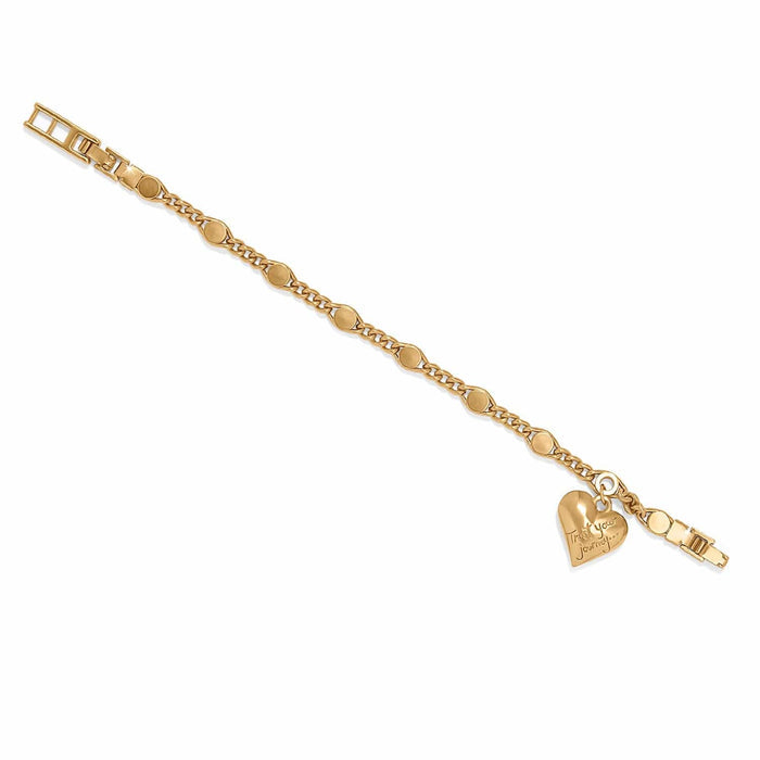 Brighton charm bracelet with gold-plated curb chain, disc links, and engraved heart charm on a white background