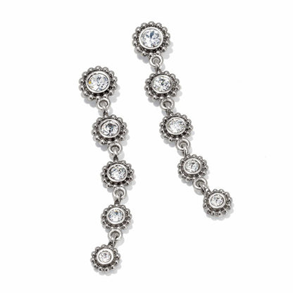 Brighton silver-plated drop earrings with linked floral-shaped stations and crystal centers on a white background