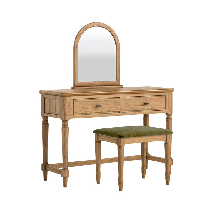 Wooden dressing table with mirror and olive green upholstered dressing stool on a white background