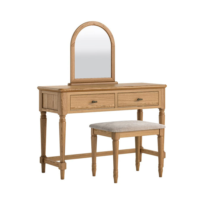 Wooden vanity table with mirror and stool with an oatmeal cushion on a white background