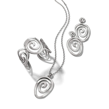 Brighton silver-plated jewelry set styled with matching spiral-design pendant necklace, cuff bracelet, and drop earrings on white background