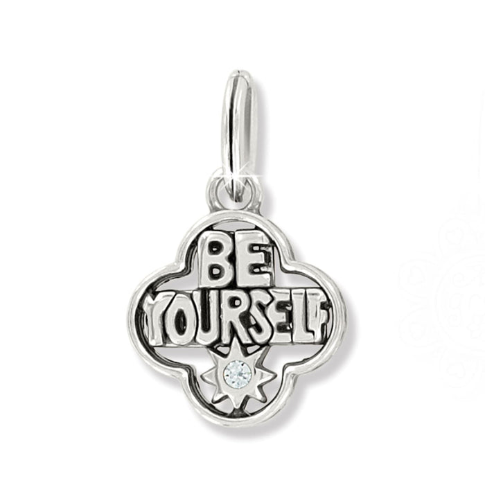 Brighton charm with Be Yourself lettering, quatrefoil frame, and crystal starburst accent on a white background