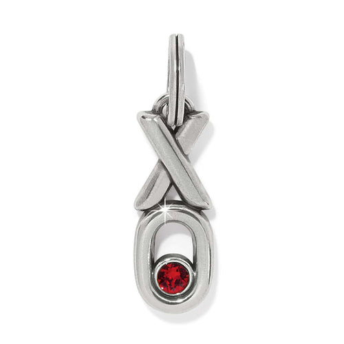 Brighton silver-plated charm with XO design and red crystal accent in the O on a white background